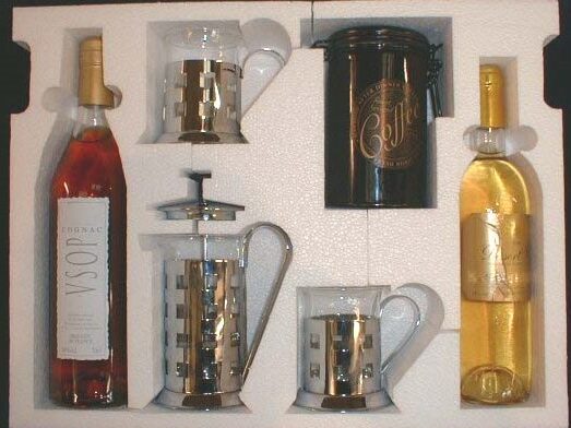 Gift set with wine, cognac, coffee, mugs, and French press arranged in custom polystyrene tray